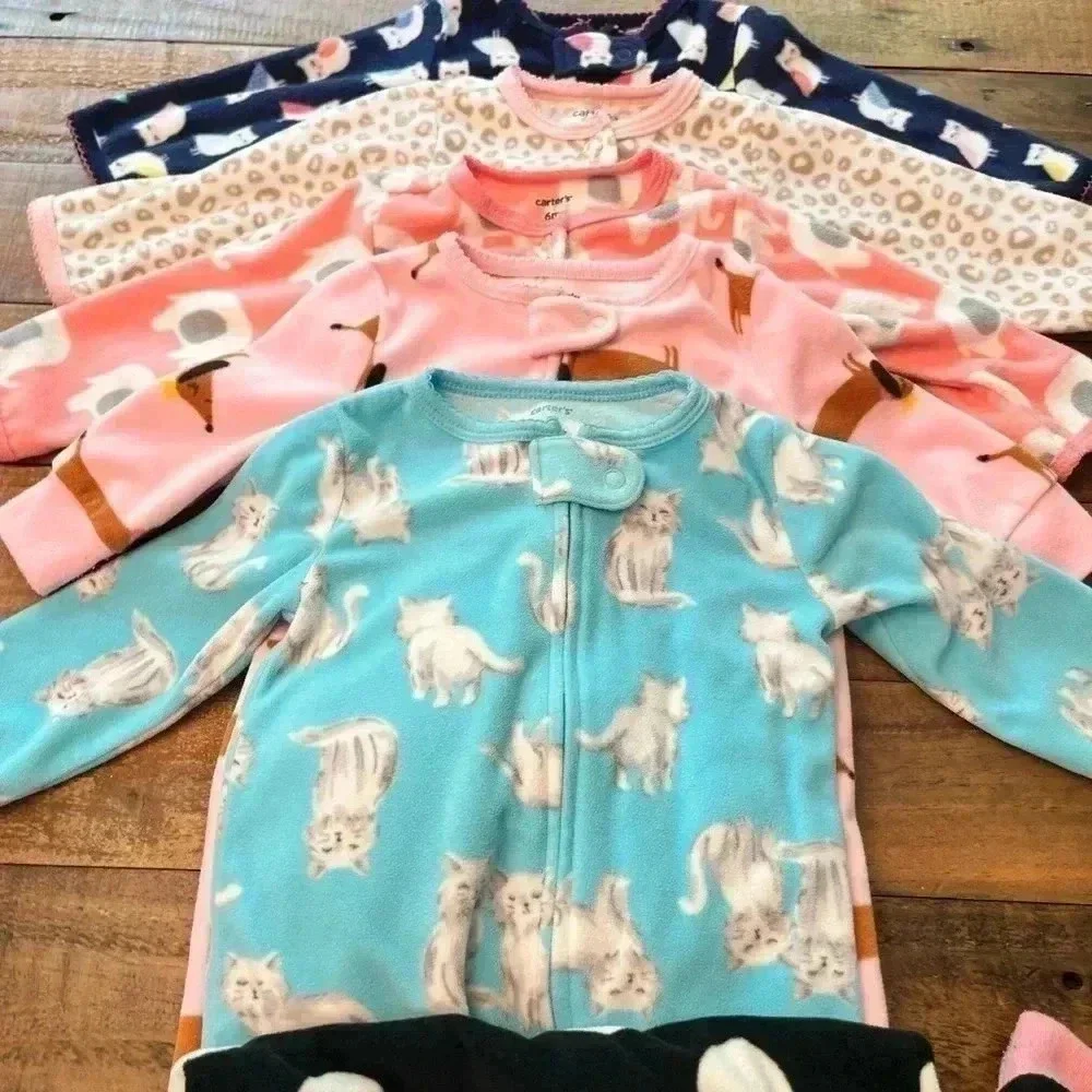 Six Carter’s Fleece Footie Pajamas